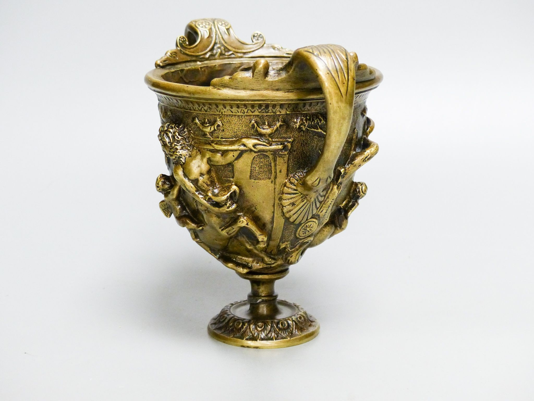 A Grand Tour style bronze cup after the Antique, 14.5 cm high